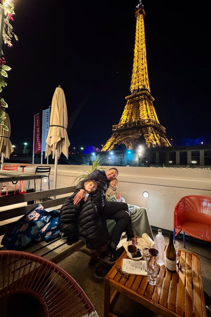 Olga and her kids watching the Eiffel Tower sparkle at night
